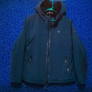 Med. Size Tommy Hilfiger weatherproof, waterproof jacket with faux fur liner.